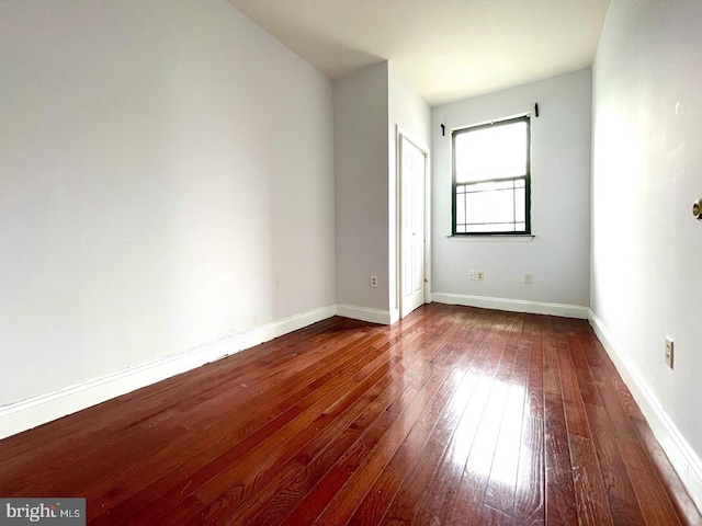 spare room featuring hardwood / wood-style floors