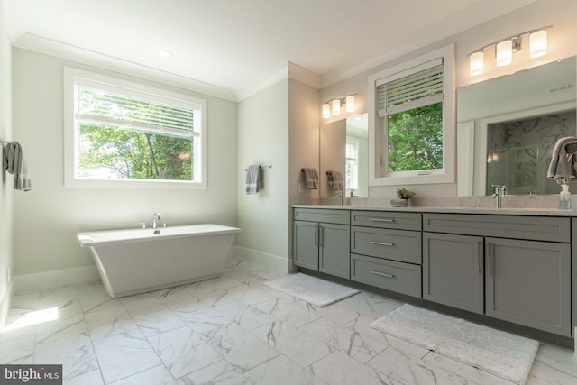 bathroom with baseboards, marble finish floor, a freestanding bath, and crown molding