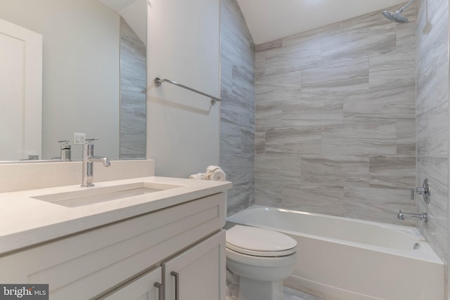 bathroom featuring tub / shower combination, vanity, and toilet