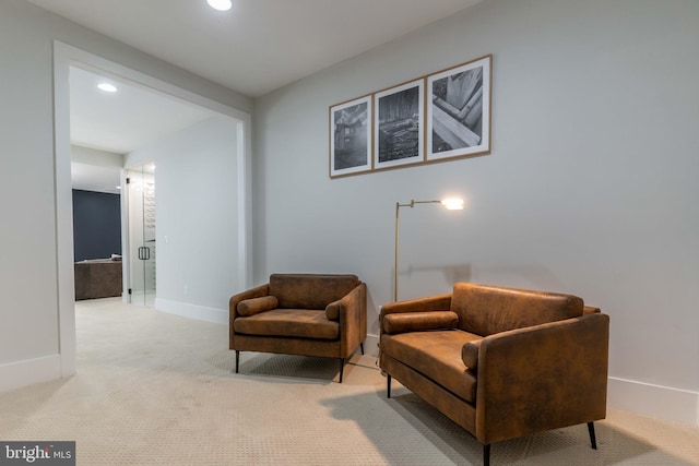 living area featuring light carpet, baseboards, and recessed lighting