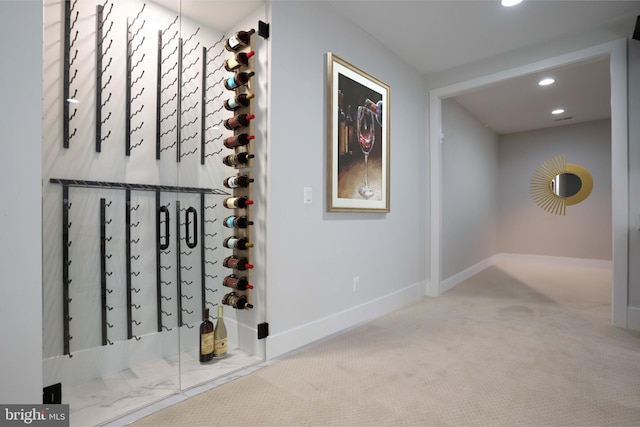 wine cellar with recessed lighting, carpet, and baseboards