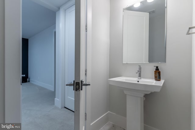 bathroom featuring baseboards and visible vents