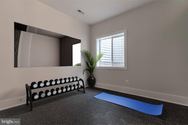 exercise room featuring baseboards and visible vents