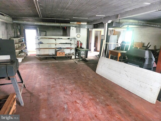 unfurnished living room with wood-type flooring