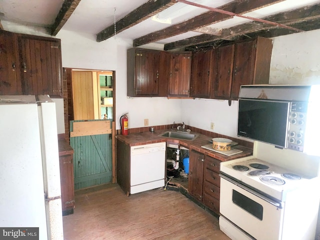 kitchen featuring white appliances, sink, light wood-type flooring, beamed ceiling, and dark brown cabinets