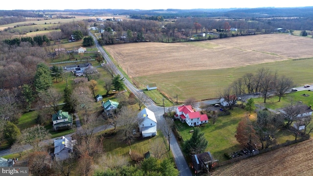 birds eye view of property with a rural view