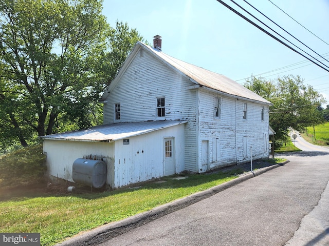 view of home's exterior featuring a lawn