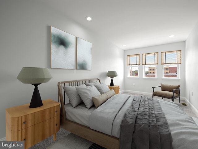 bedroom featuring baseboards and recessed lighting