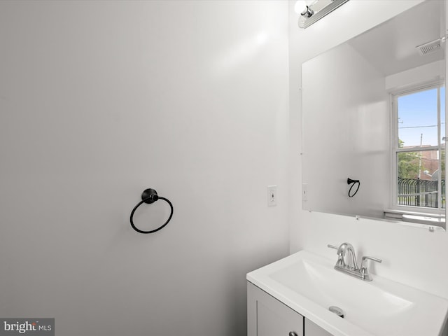 bathroom with visible vents and vanity