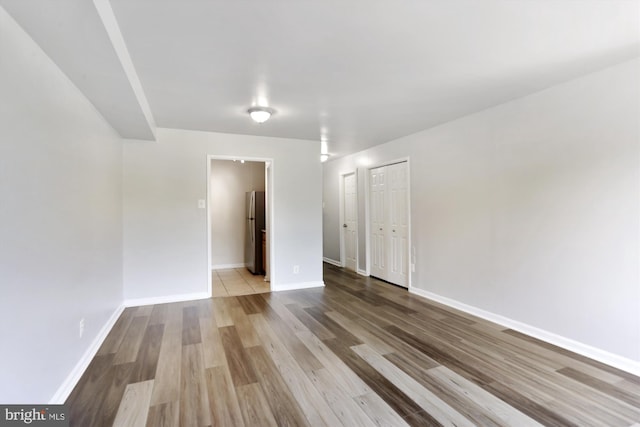 spare room with light wood-type flooring