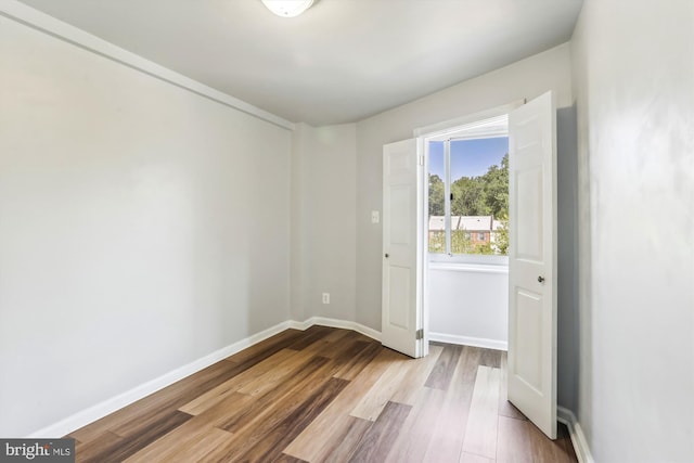 unfurnished room featuring light wood-type flooring