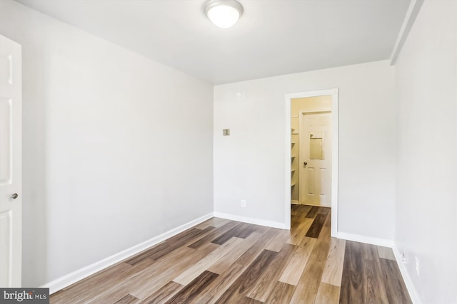 empty room featuring hardwood / wood-style floors