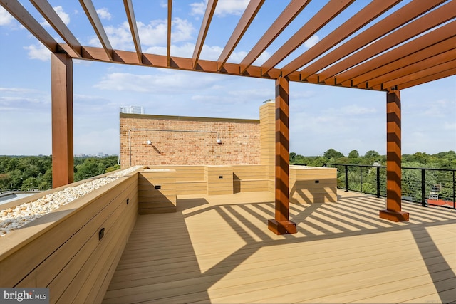 wooden deck featuring a pergola