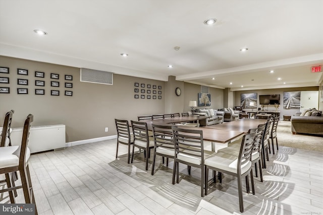 dining area featuring beam ceiling