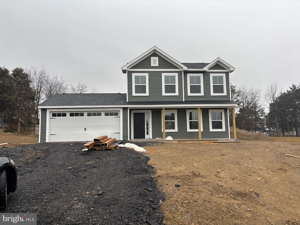 view of front of house featuring a garage and covered porch