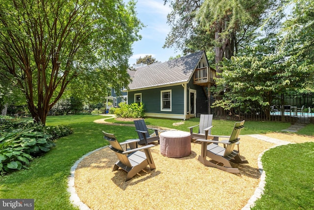 view of yard with a fire pit