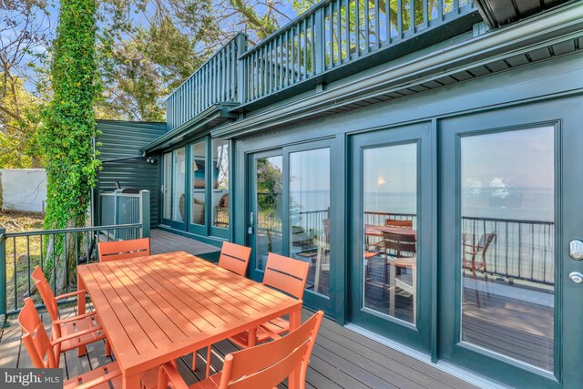 wooden deck with a water view