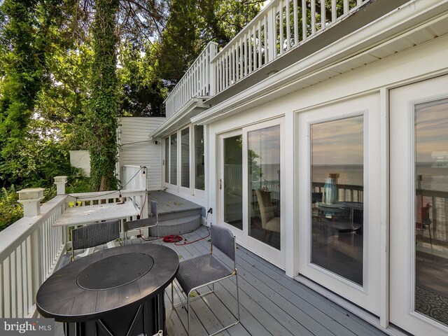 balcony featuring a water view