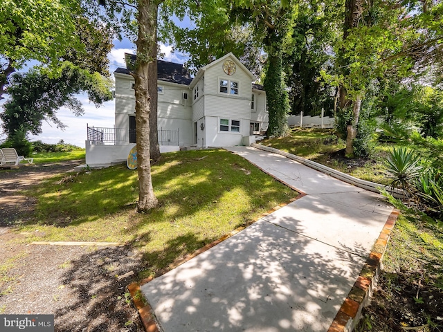 view of front of home with a front yard