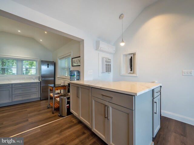 bedroom with a water view, dark hardwood / wood-style flooring, access to outside, and an AC wall unit