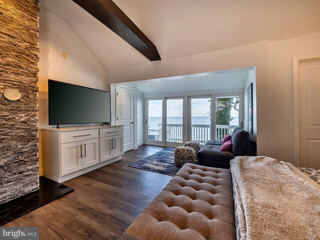 kitchen featuring lofted ceiling, stainless steel appliances, backsplash, hardwood / wood-style flooring, and sink