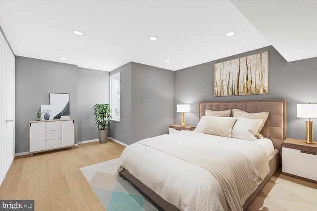 bedroom featuring recessed lighting, light wood-type flooring, and baseboards