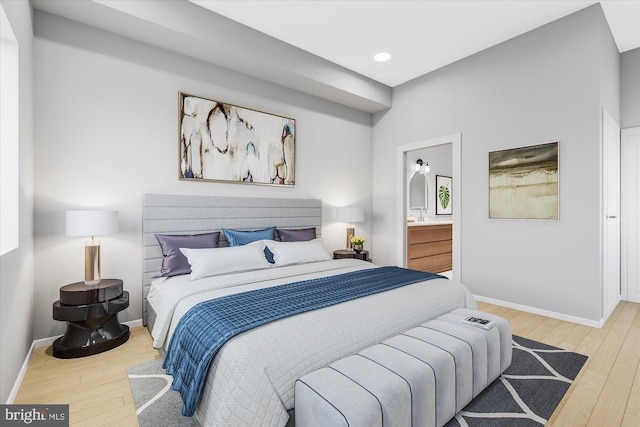 bedroom featuring recessed lighting, light wood-type flooring, and baseboards