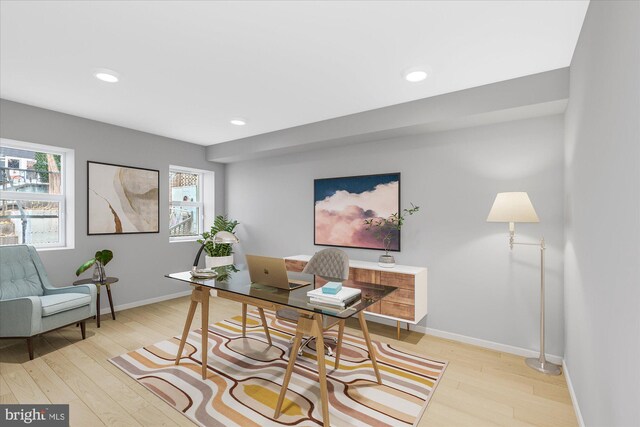 office space with light wood-style flooring, baseboards, and recessed lighting