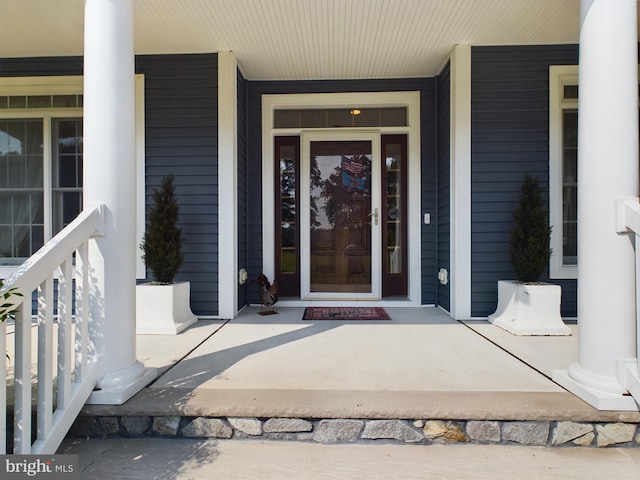 doorway to property featuring a porch