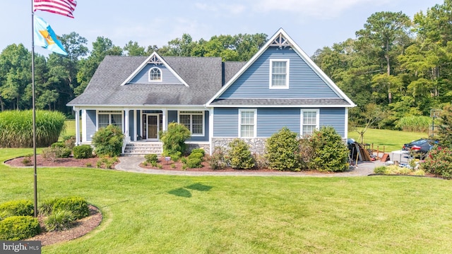 view of front of property with stone siding, a front lawn, and a porch