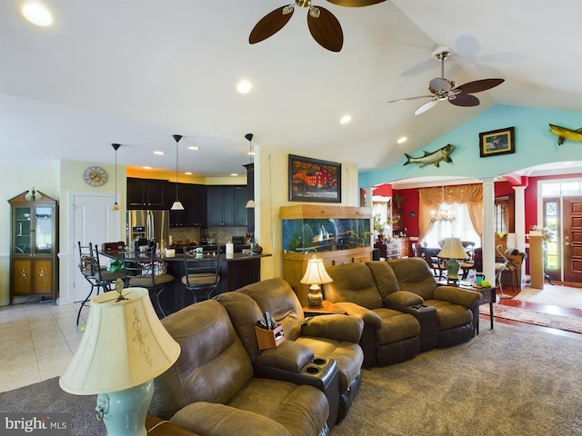 living area with ceiling fan, vaulted ceiling, ornate columns, and light tile patterned floors