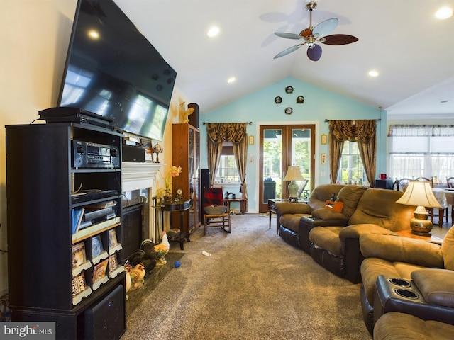 carpeted living area with ceiling fan, a fireplace, vaulted ceiling, and recessed lighting