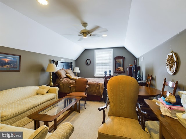 bedroom featuring lofted ceiling, light colored carpet, and ceiling fan