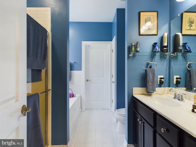 full bath with toilet, a garden tub, vanity, and tile patterned floors