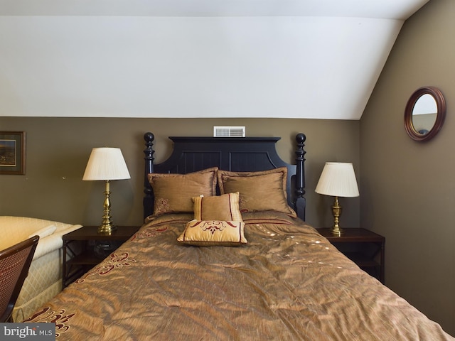 bedroom with vaulted ceiling