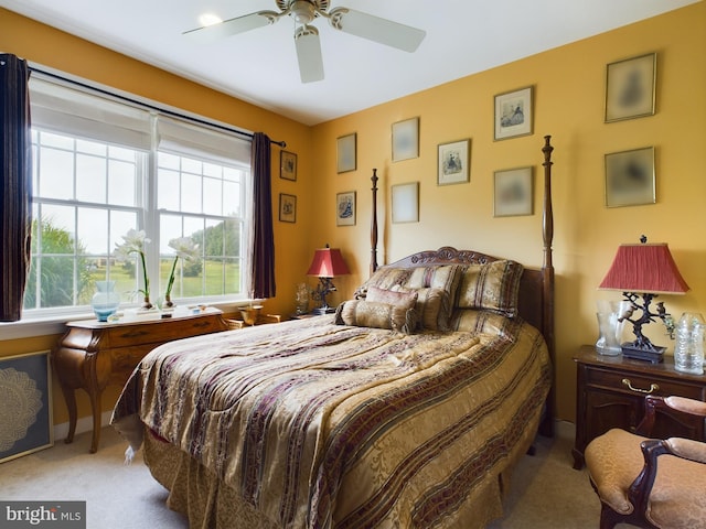 bedroom featuring light carpet and ceiling fan