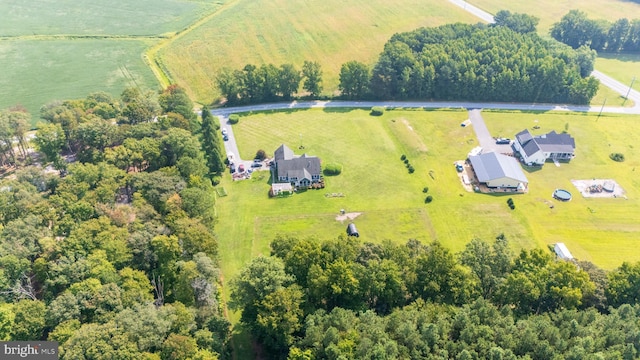 birds eye view of property with a rural view