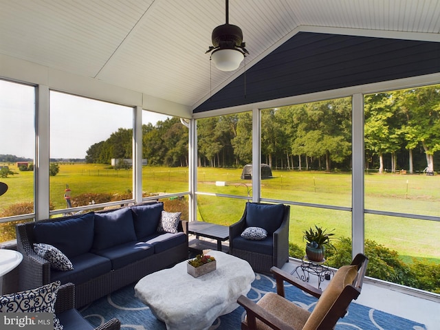 sunroom / solarium featuring vaulted ceiling