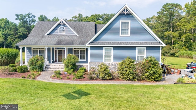 view of front of property featuring a porch and a front lawn