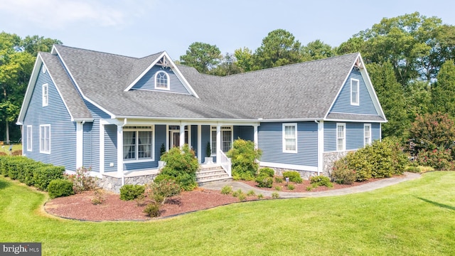 view of front facade featuring covered porch and a front yard