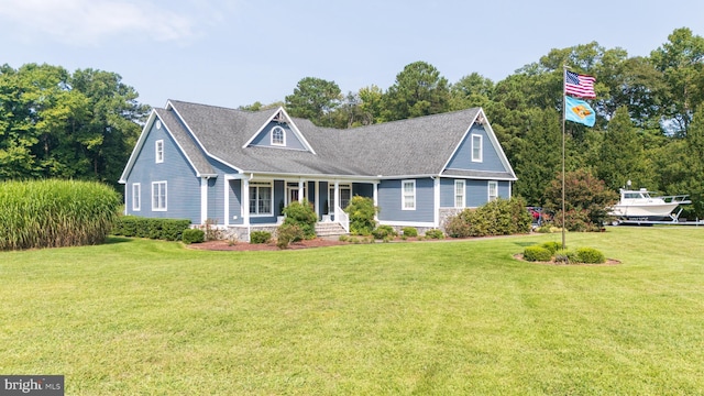 cape cod-style house with a front lawn and a porch