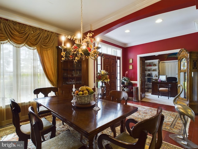 dining area featuring ornamental molding, recessed lighting, wood finished floors, and an inviting chandelier