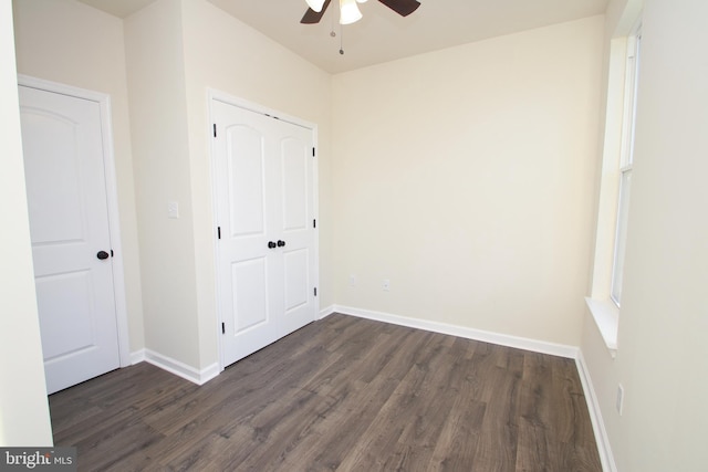 unfurnished bedroom with ceiling fan and hardwood / wood-style flooring