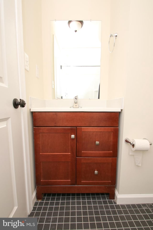 bathroom featuring vanity and tile patterned flooring