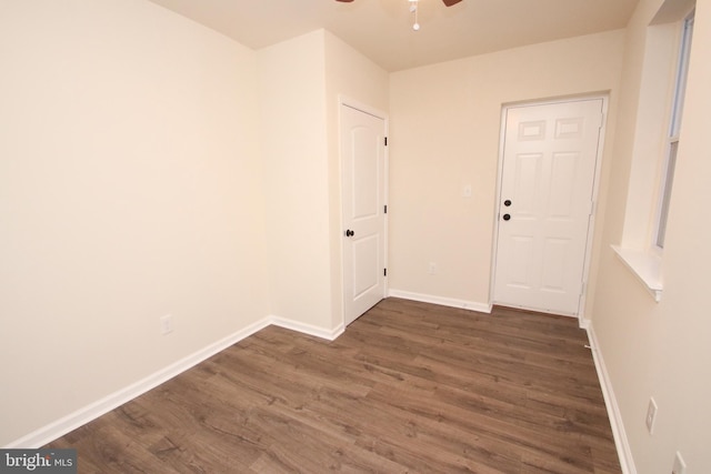 empty room with ceiling fan and hardwood / wood-style flooring