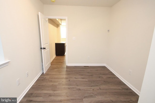 empty room featuring wood-type flooring