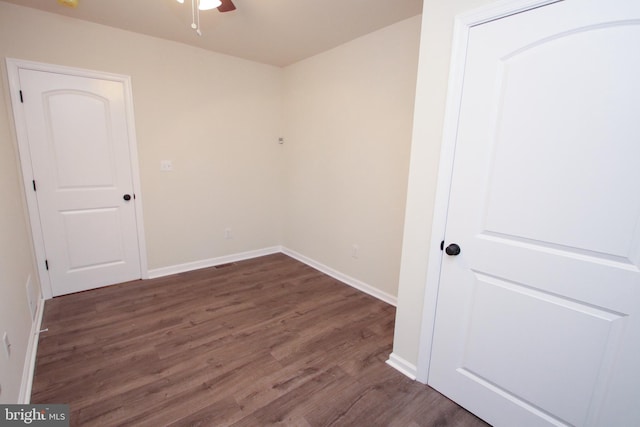 spare room with hardwood / wood-style floors and ceiling fan