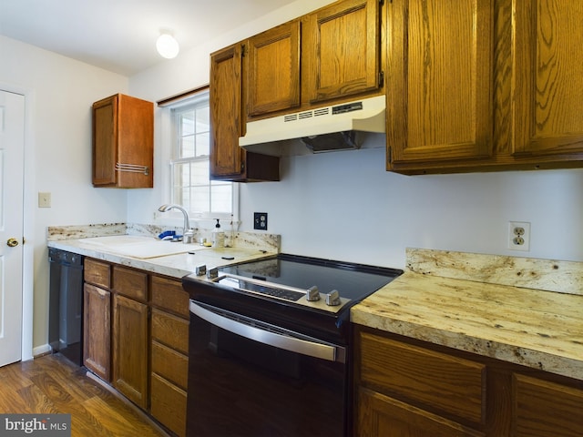 kitchen with dishwasher, sink, dark hardwood / wood-style floors, and electric stove