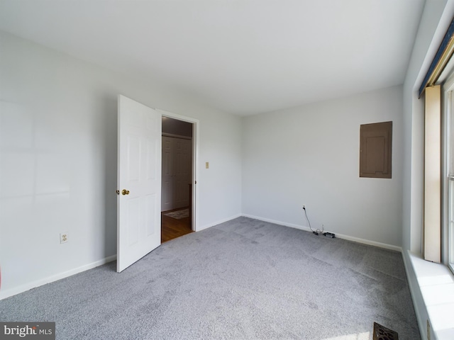 unfurnished bedroom with carpet flooring and electric panel