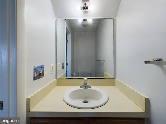 bathroom with vanity and toilet